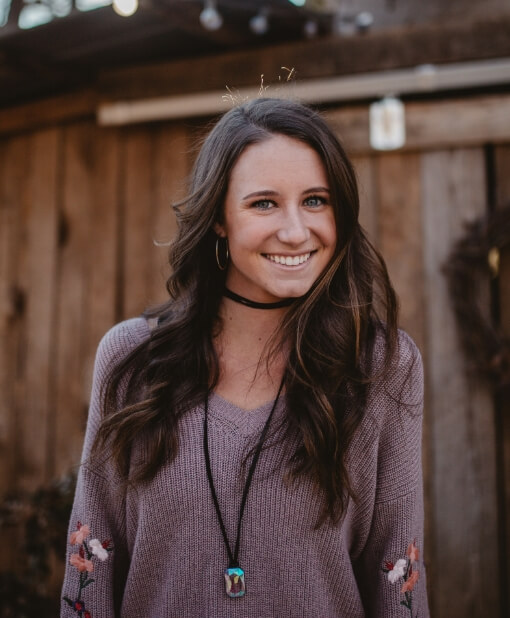 woman-smiling-in-sweater